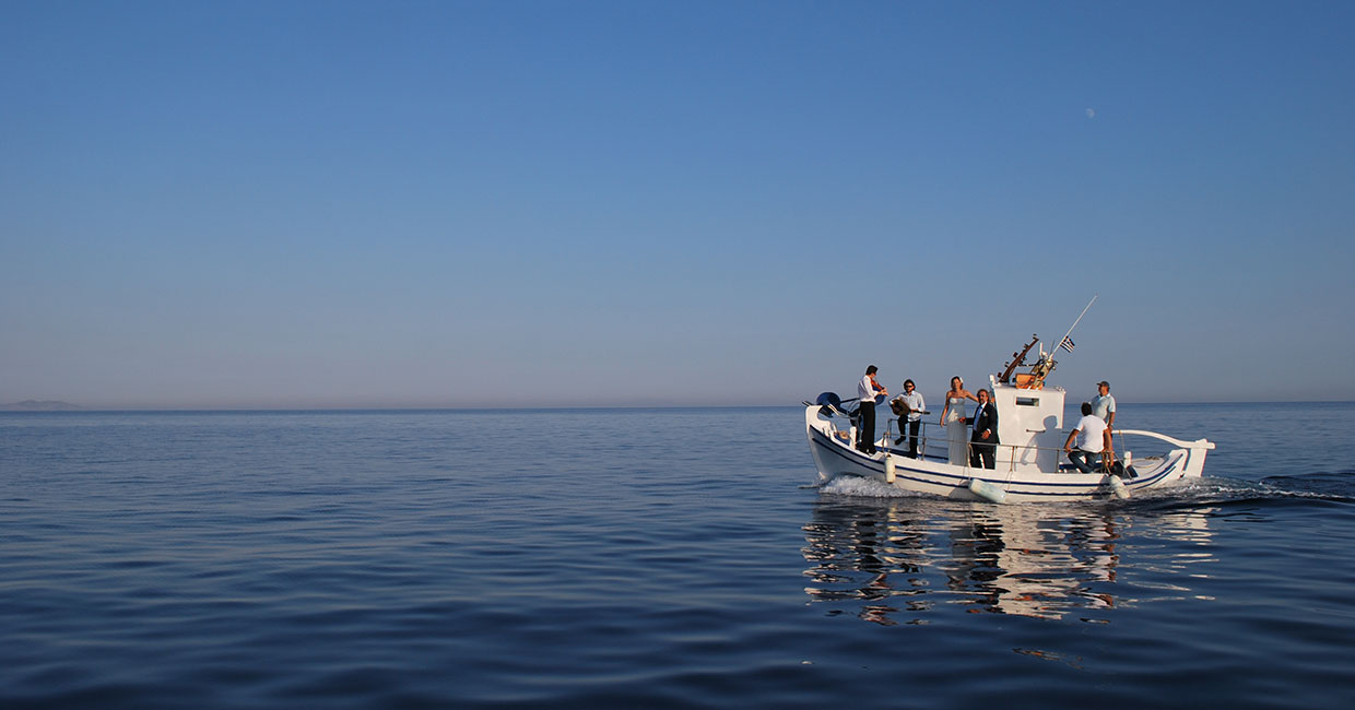 Bride transfer with a traditional wooden boat